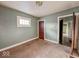 Neutral bedroom featuring carpeted floors, a window, closet space and natural light at 3610 Robson St, Indianapolis, IN 46201