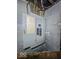 Electrical panel with circuit breakers on a painted block wall in the basement at 3610 Robson St, Indianapolis, IN 46201
