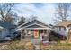 Charming craftsman-style home featuring a welcoming front porch and orange front door at 3610 Robson St, Indianapolis, IN 46201