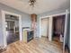 View of the kitchen area showing white appliances and open doorways to adjacent rooms at 3610 Robson St, Indianapolis, IN 46201