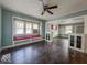 Living room featuring hardwood floors, built in cabinets, and a window seat at 3610 Robson St, Indianapolis, IN 46201