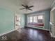 Living room featuring hardwood floors, a ceiling fan, and a window seat at 3610 Robson St, Indianapolis, IN 46201