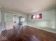 Living room featuring hardwood floors and large windows at 3610 Robson St, Indianapolis, IN 46201