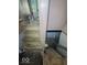 Split staircase leading to the basement has two different directions for easy access at 3610 Robson St, Indianapolis, IN 46201