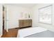 Bedroom with a streamlined look, wood-look floors, and a large window at 4035 N Kenwood Ave, Indianapolis, IN 46208
