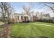 Attractive single-story house boasting a lush green lawn and a walkway leading to the front door at 4035 N Kenwood Ave, Indianapolis, IN 46208