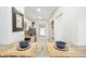 Pass-through view into a modern kitchen featuring granite countertops, stainless steel appliances, and ample cabinet space at 4035 N Kenwood Ave, Indianapolis, IN 46208