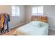 Clean, neutral bedroom featuring a headboard with storage and a small closet at 4113 Gambel Rd, Indianapolis, IN 46221