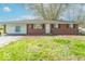 Ranch style home featuring a mix of brick and siding with a grassy front yard at 4113 Gambel Rd, Indianapolis, IN 46221