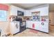 Kitchen with white cabinets, dark appliances, and a cozy breakfast nook at 4113 Gambel Rd, Indianapolis, IN 46221