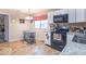 Bright kitchen featuring white cabinets, modern appliances, and a small dining area at 4113 Gambel Rd, Indianapolis, IN 46221
