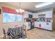 Functional kitchen with white cabinetry, table with chairs, and natural light at 4113 Gambel Rd, Indianapolis, IN 46221