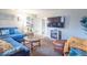 Comfortable living room with a blue sofa, fireplace, and cozy decor at 4113 Gambel Rd, Indianapolis, IN 46221