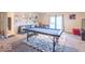 Open living area with a pool table, comfortable seating, and stylish decor at 4113 Gambel Rd, Indianapolis, IN 46221
