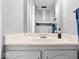 Functional bathroom featuring a single sink vanity with storage and a well-lit mirror at 4307 Dahlia Ct, Indianapolis, IN 46220