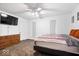 This bedroom features neutral paint, two windows, a ceiling fan and an ensuite bathroom at 4307 Dahlia Ct, Indianapolis, IN 46220