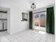 Bright dining area with tile floors and sliding glass door to outdoor deck at 4307 Dahlia Ct, Indianapolis, IN 46220