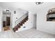 Foyer with tile floors, staircase, and coat closet at 4307 Dahlia Ct, Indianapolis, IN 46220