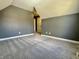 Cozy attic bedroom features sloped ceilings, neutral carpeting, and plenty of natural light at 4309 Worchester Ct, Carmel, IN 46033