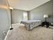 Cozy bedroom featuring plush carpeting and a bright window at 4309 Worchester Ct, Carmel, IN 46033