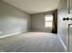 Well-lit bedroom with neutral walls, plush carpeting, and a large window at 4309 Worchester Ct, Carmel, IN 46033
