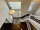 View from above of the foyer with hardwood floors and an open staircase at 4309 Worchester Ct, Carmel, IN 46033