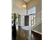 Bright foyer with hardwood floors, an open staircase and a gray painted wall at 4309 Worchester Ct, Carmel, IN 46033