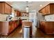 Bright kitchen featuring custom cabinetry, stainless steel appliances, granite counters, and a functional center island at 4309 Worchester Ct, Carmel, IN 46033