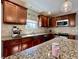 Kitchen highlights custom cabinetry, granite countertops, stainless steel appliances, and stylish tile backsplash at 4309 Worchester Ct, Carmel, IN 46033