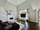 Bright living room featuring a fireplace, high ceilings, and comfortable seating area at 4309 Worchester Ct, Carmel, IN 46033