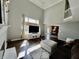 Spacious living room featuring high ceilings, a fireplace, and views into the dining and kitchen area at 4309 Worchester Ct, Carmel, IN 46033