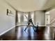 Spacious living room with hardwood floors and three windows at 4309 Worchester Ct, Carmel, IN 46033