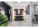 Luxurious bathroom with a double vanity, stylish mirror, designer lighting, and a modern glass shower at 4501 N Wheeling Ave # 6A - 201, Muncie, IN 47304