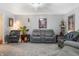 Spacious living room with plush grey carpet, neutral walls, and modern furnishings at 4501 N Wheeling Ave # 6A - 201, Muncie, IN 47304
