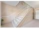 Carpeted staircase with white railing, providing access to upper floors at 4501 N Wheeling Ave # 6A - 201, Muncie, IN 47304