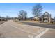 A charming neighborhood street view showcasing the Halteman Villas community entrance sign at 4501 N Wheeling Ave # 6A - 201, Muncie, IN 47304