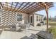 Charming back patio with a pergola, dining set, and a comfortable seating area, perfect for outdoor relaxation at 481 Autumn Springs Ct, Avon, IN 46123