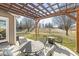 Back patio showcasing an outdoor dining area and fire pit overlooking a spacious backyard, ideal for entertaining at 481 Autumn Springs Ct, Avon, IN 46123