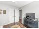 Bedroom featuring hardwood floors, updated light fixtures, neutral walls, and closet space at 481 Autumn Springs Ct, Avon, IN 46123