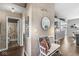Hallway with wood floors, decorative wall art, and a view to a bathroom and the rest of the home at 481 Autumn Springs Ct, Avon, IN 46123
