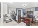 Bright kitchen featuring stainless steel appliances, stone countertops, wood floors and an accent wall at 481 Autumn Springs Ct, Avon, IN 46123