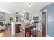 Modern kitchen featuring stainless steel appliances, gray cabinets, island, and hardwood floors at 481 Autumn Springs Ct, Avon, IN 46123