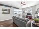 Comfortable living room featuring hardwood floors, a fireplace, and an open view to the kitchen at 481 Autumn Springs Ct, Avon, IN 46123
