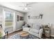 Comfortable living room with natural light, comfortable seating, hardwood floors and neutral walls at 481 Autumn Springs Ct, Avon, IN 46123