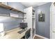 Cozy office featuring custom shelving, a comfortable workspace, and hardwood floors at 481 Autumn Springs Ct, Avon, IN 46123