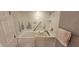 Modern walk-in tub with safety grab bars and decorative tile surround at 4969 Fairway Dr, Avon, IN 46123