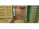 Bathroom featuring a double vanity, tiled shower with glass door, and glass block wall feature at 4969 Fairway Dr, Avon, IN 46123