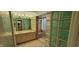 Bathroom features a double vanity sink, tiled shower with sliding door, and unique glass block privacy wall at 4969 Fairway Dr, Avon, IN 46123
