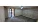 Bedroom featuring sliding glass door to the outside, neutral carpet, and decorative curtains at 4969 Fairway Dr, Avon, IN 46123