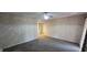 Large bedroom with a ceiling fan and sliding door with curtains, with neutral colored carpet at 4969 Fairway Dr, Avon, IN 46123